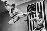 Master Ueshiro performing flying side kick.